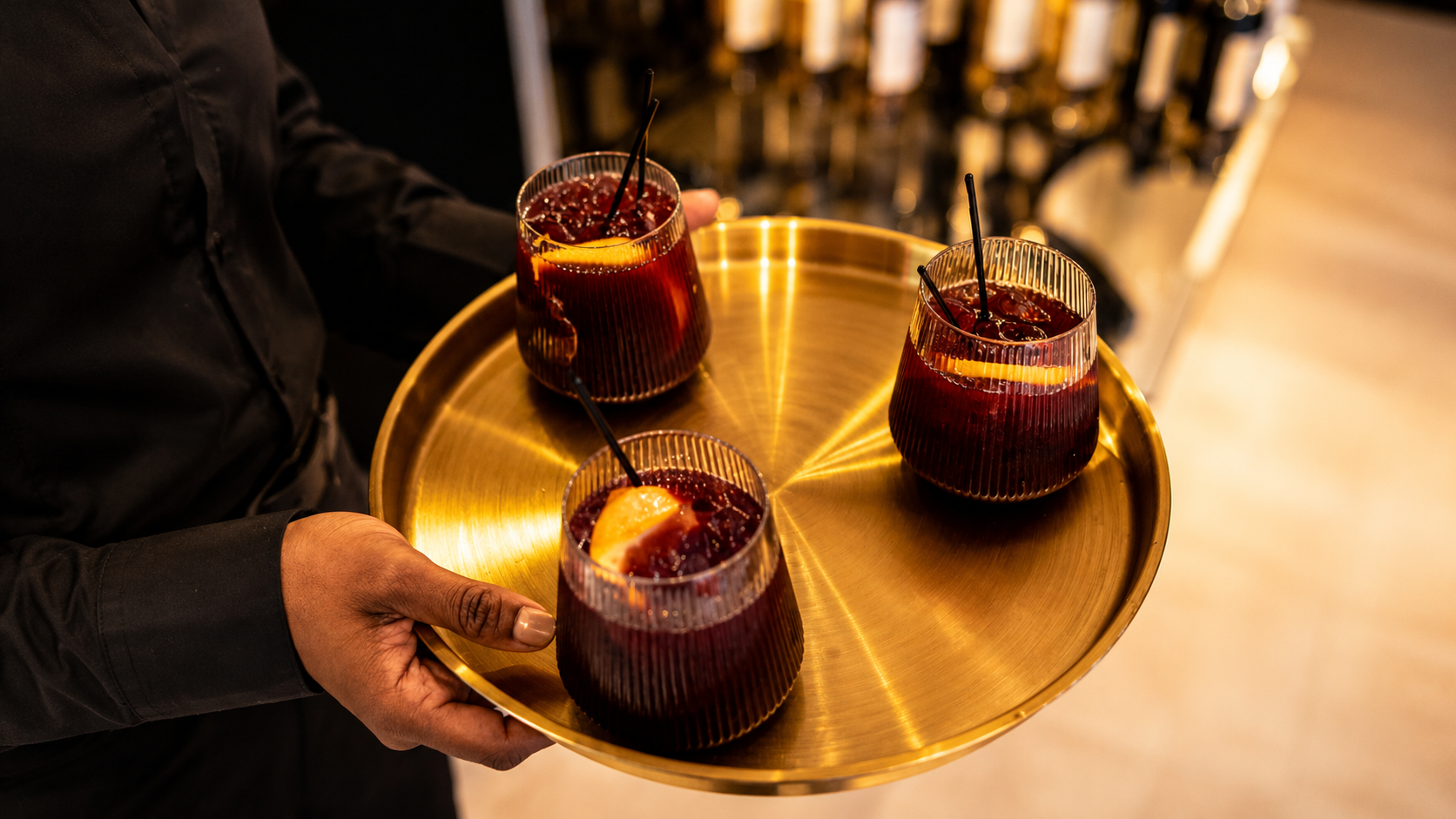 Signature cocktails on a gold tray